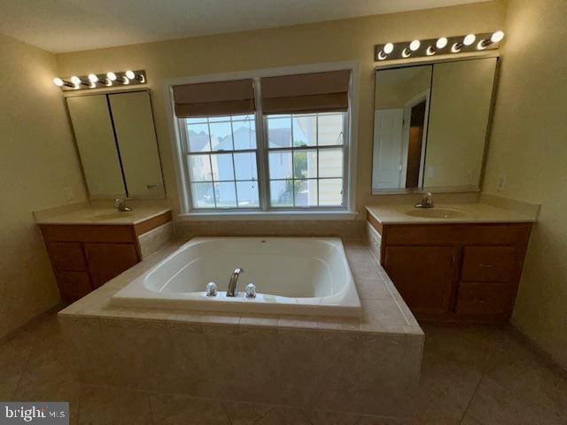 12410 Coastal Marsh Dr, Berlin, MD 21811 - full bathroom with a garden tub, two vanities, and tile patterned floors