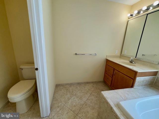12410 Coastal Marsh Dr, Berlin, MD 21811 - full bath featuring a garden tub, vanity, and tile patterned flooring