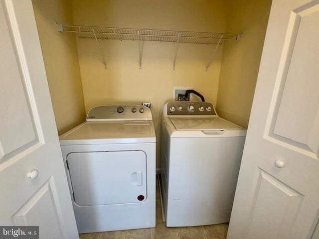 12410 Coastal Marsh Dr, Berlin, MD 21811 - laundry room with separate washer and dryer and light tile patterned floors