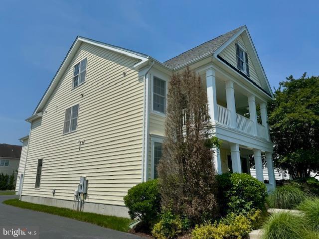 12410 Coastal Marsh Dr, Berlin, MD 21811 - view of home's exterior with a balcony