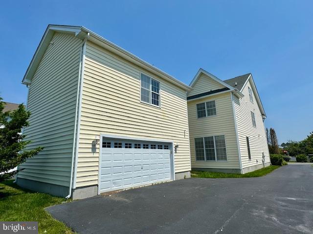 12410 Coastal Marsh Dr, Berlin, MD 21811 - view of property exterior featuring driveway and a garage