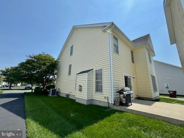 12410 Coastal Marsh Dr, Berlin, MD 21811 - view of home's exterior with a lawn and a cooling unit