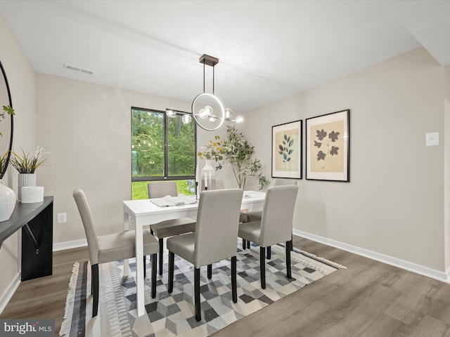 9124 Goldamber Garth, Columbia, MD 21045 - dining area with wood finished floors and a chandelier