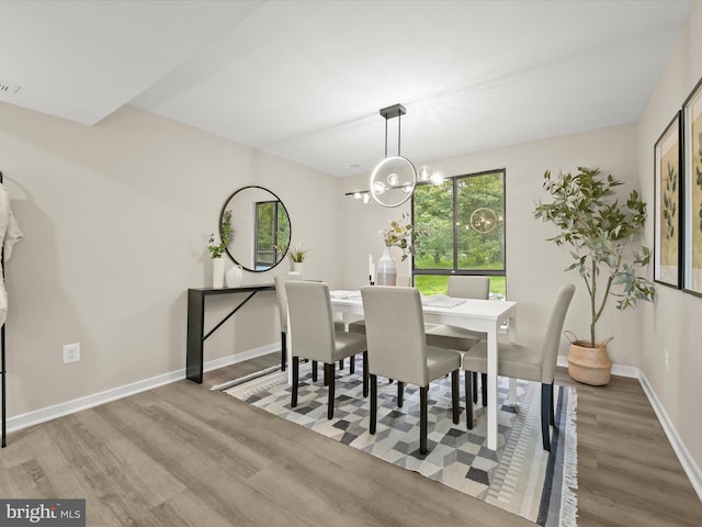 9124 Goldamber Garth, Columbia, MD 21045 - dining area with wood finished floors and a chandelier