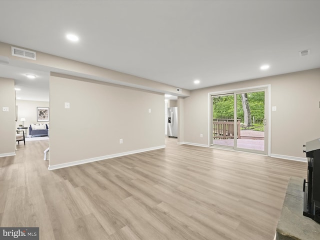 9124 Goldamber Garth, Columbia, MD 21045 - unfurnished living room featuring light wood-style floors and recessed lighting