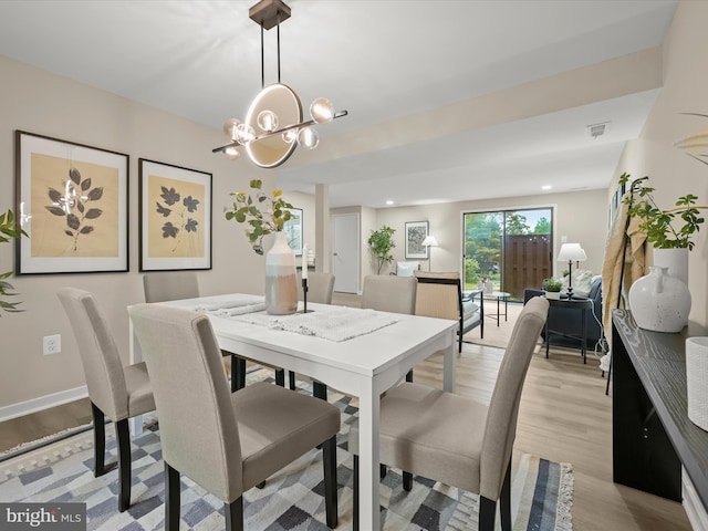9124 Goldamber Garth, Columbia, MD 21045 - dining room with light wood-type flooring, a chandelier, and recessed lighting