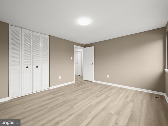 9124 Goldamber Garth, Columbia, MD 21045 - unfurnished bedroom with light wood-type flooring and a closet