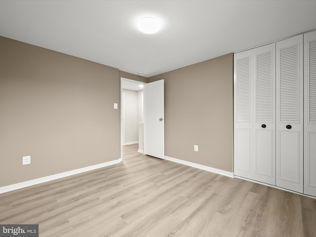 9124 Goldamber Garth, Columbia, MD 21045 - unfurnished bedroom featuring light wood-style flooring and a closet