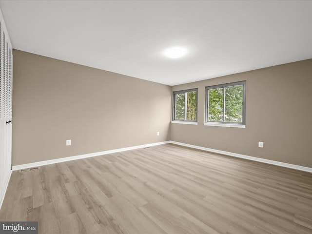 9124 Goldamber Garth, Columbia, MD 21045 - spare room with light wood-style flooring and baseboards