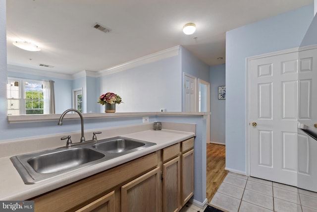 1581 Spring Gate Dr Unit 5309, Mclean, VA 22102 - kitchen featuring crown molding, light tile patterned floors, and light countertops