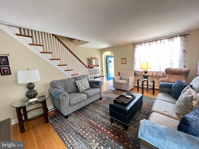 1838 Benson St, Philadelphia, PA 19152 - living area with arched walkways, wood-type flooring, and stairway