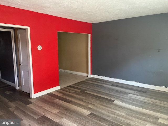 2133 Seneca Rd, Wilmington, DE 19805 - empty room featuring wood finished floors and a textured ceiling