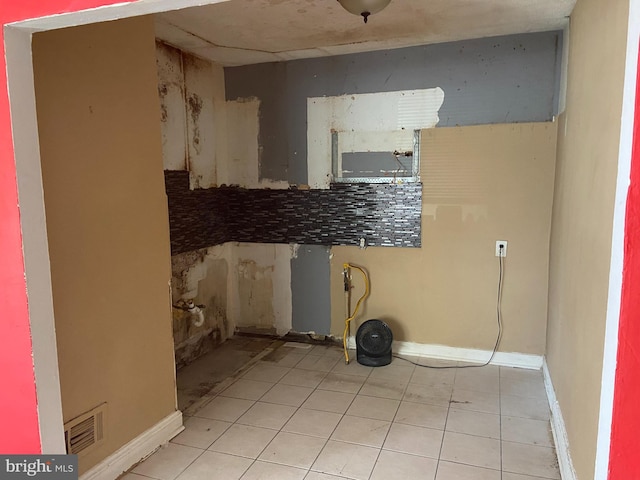 2133 Seneca Rd, Wilmington, DE 19805 - washroom featuring light tile patterned floors and baseboards