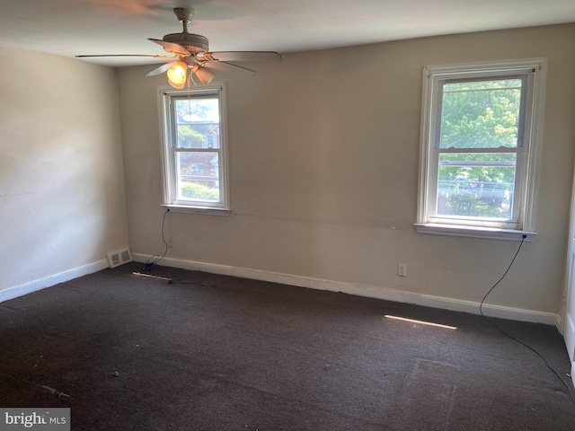 2133 Seneca Rd, Wilmington, DE 19805 - spare room featuring dark colored carpet and ceiling fan