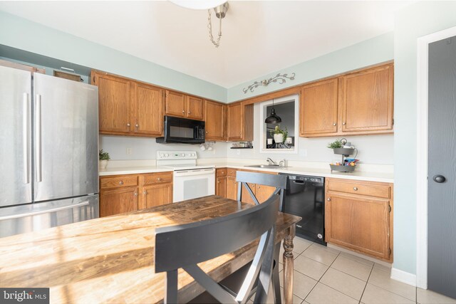219 Flint Hill Rd, Alburtis, PA 18011 - kitchen with black appliances, light countertops, light tile patterned floors, and brown cabinets