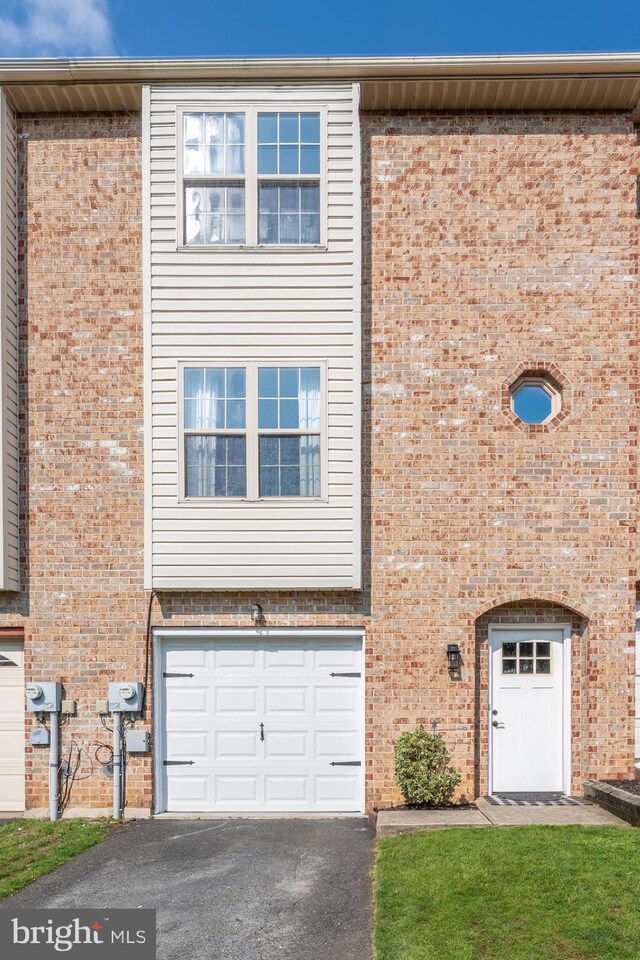 219 Flint Hill Rd, Alburtis, PA 18011 - multi unit property featuring brick siding, asphalt driveway, and a garage