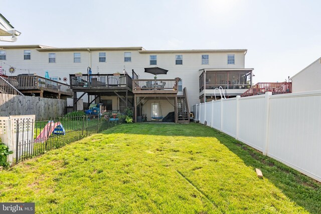 219 Flint Hill Rd, Alburtis, PA 18011 - rear view of property with stairs, a fenced backyard, a deck, and a sunroom