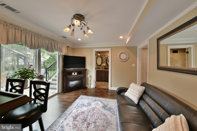 342 Glenn Ave, Lawrenceville, NJ 08648 - living area with a glass covered fireplace, wood finished floors, ornamental molding, and recessed lighting