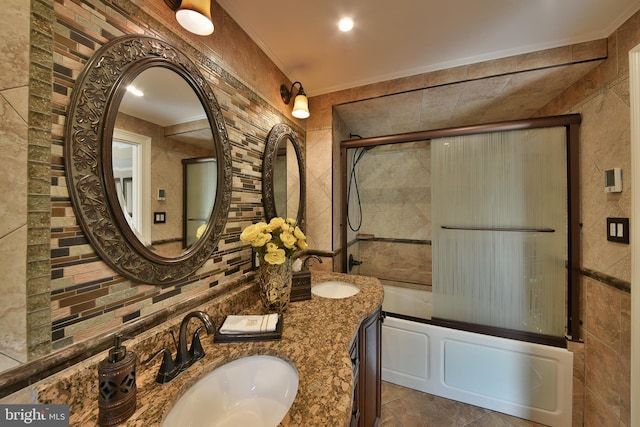 342 Glenn Ave, Lawrenceville, NJ 08648 - full bathroom featuring tile walls, shower / bath combination with glass door, ornamental molding, and double vanity