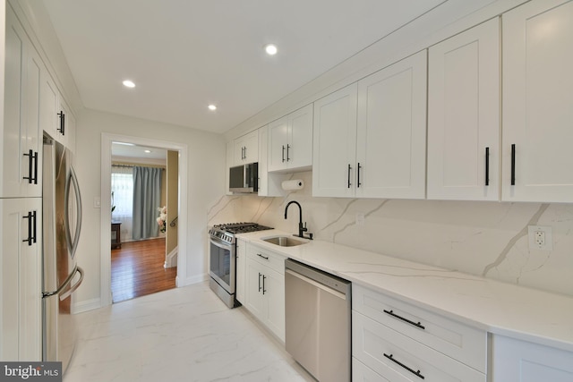 342 Glenn Ave, Lawrenceville, NJ 08648 - kitchen with appliances with stainless steel finishes, white cabinetry, light stone counters, recessed lighting, and decorative backsplash