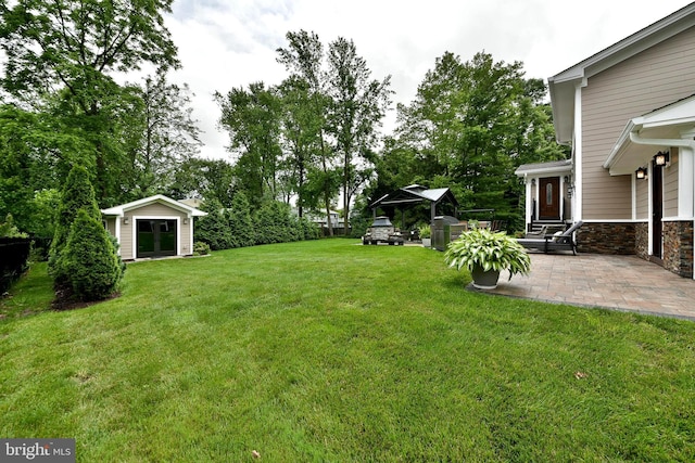 342 Glenn Ave, Lawrenceville, NJ 08648 - view of green lawn with a patio and an outbuilding