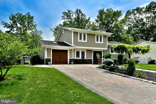 342 Glenn Ave, Lawrenceville, NJ 08648 - view of front of property featuring decorative driveway, an attached garage, a front yard, and stone siding