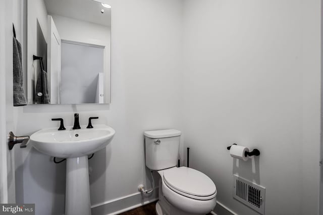 3509 Sutton Heights Cir, Fairfax, VA 22031 - half bathroom featuring baseboards and wood finished floors