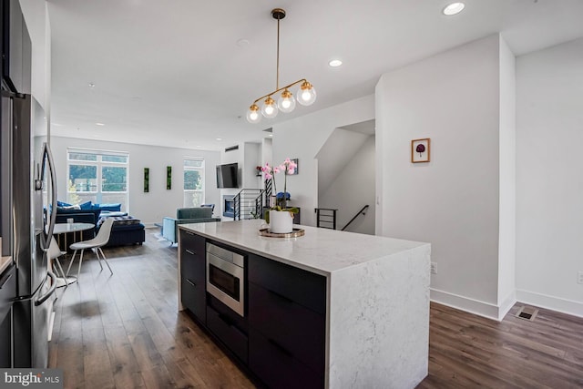 3509 Sutton Heights Cir, Fairfax, VA 22031 - kitchen featuring appliances with stainless steel finishes, modern cabinets, dark wood-type flooring, a kitchen island, and open floor plan