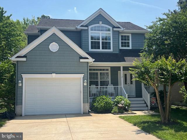 17 Alden Ct, Ocean Pines, MD 21811 - view of front of property featuring covered porch, concrete driveway, and a garage