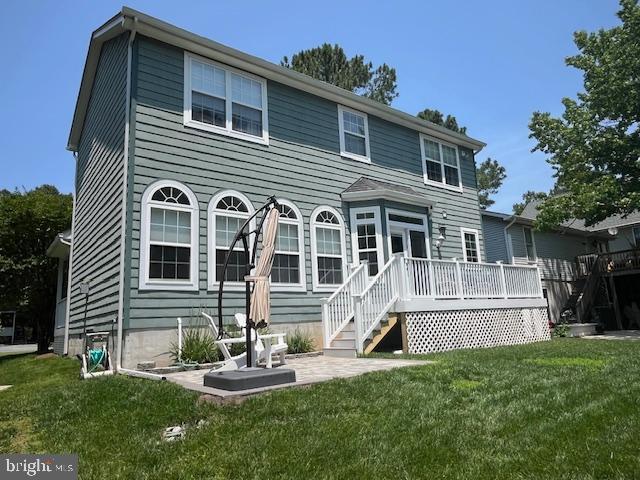 17 Alden Ct, Ocean Pines, MD 21811 - back of property with a lawn, a wooden deck, and a patio area
