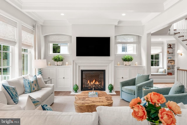 204 Walnut Tree Ln, Malvern, PA 19355 - living area with beamed ceiling, wood finished floors, a fireplace with flush hearth, ornamental molding, and stairs