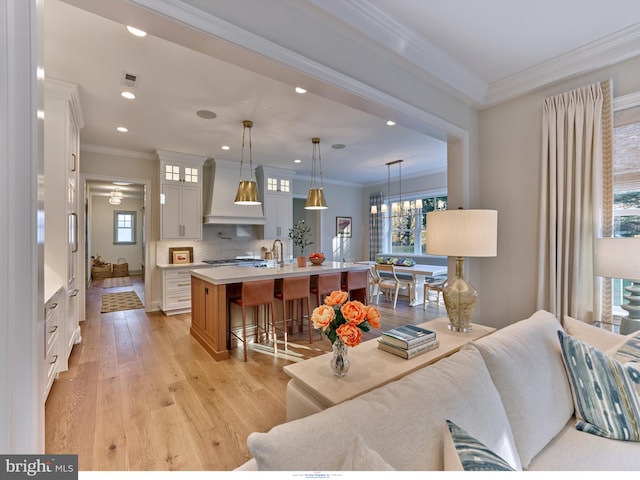 204 Walnut Tree Ln, Malvern, PA 19355 - living area featuring light wood-style flooring, ornamental molding, and recessed lighting