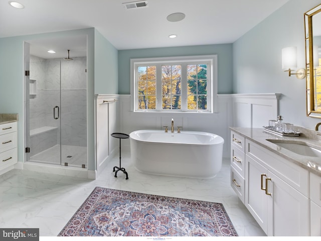 204 Walnut Tree Ln, Malvern, PA 19355 - bathroom featuring marble look tiles, a stall shower, vanity, a wainscoted wall, and a freestanding bath