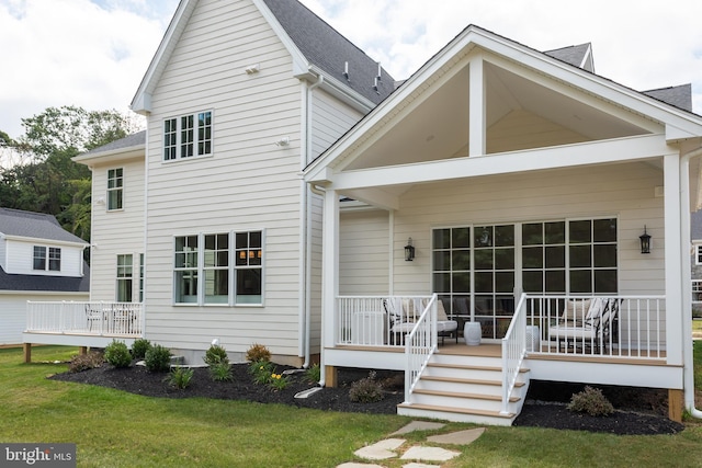 204 Walnut Tree Ln, Malvern, PA 19355 - back of property featuring a yard, covered porch, and a shingled roof