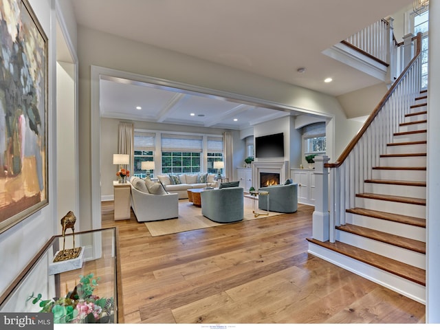 204 Walnut Tree Ln, Malvern, PA 19355 - living area featuring light wood-type flooring, stairs, a lit fireplace, beam ceiling, and recessed lighting
