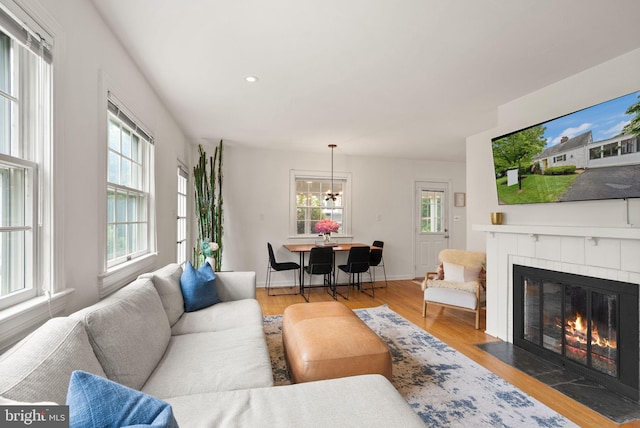 6018 25th Rd N, Arlington, VA 22207 - living area featuring a tile fireplace, wood finished floors, a chandelier, and recessed lighting