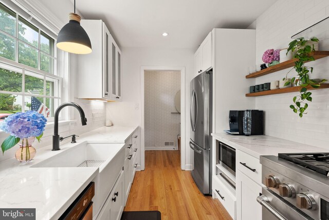 6018 25th Rd N, Arlington, VA 22207 - kitchen with appliances with stainless steel finishes, white cabinetry, decorative backsplash, light stone counters, and recessed lighting