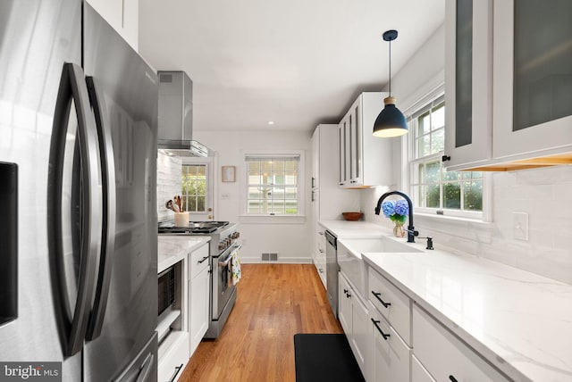 6018 25th Rd N, Arlington, VA 22207 - kitchen featuring appliances with stainless steel finishes, exhaust hood, plenty of natural light, tasteful backsplash, and recessed lighting