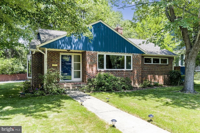 301 Pine St, Falls Church, VA 22046 - view of front of home featuring brick siding and a chimney