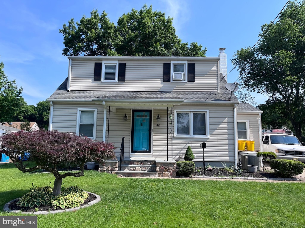 40 Fogarty Dr, Hamilton, NJ 08619 - view of front of house featuring a chimney, a front lawn, and a shingled roof