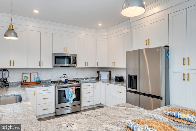 209 N New York Ave Unit 2, North Wildwood, NJ 08260 - kitchen with stainless steel appliances, white cabinets, decorative light fixtures, light stone counters, and ornamental molding