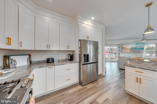 209 N New York Ave Unit 2, North Wildwood, NJ 08260 - kitchen with stainless steel refrigerator with ice dispenser, white cabinets, decorative light fixtures, light wood finished floors, and recessed lighting