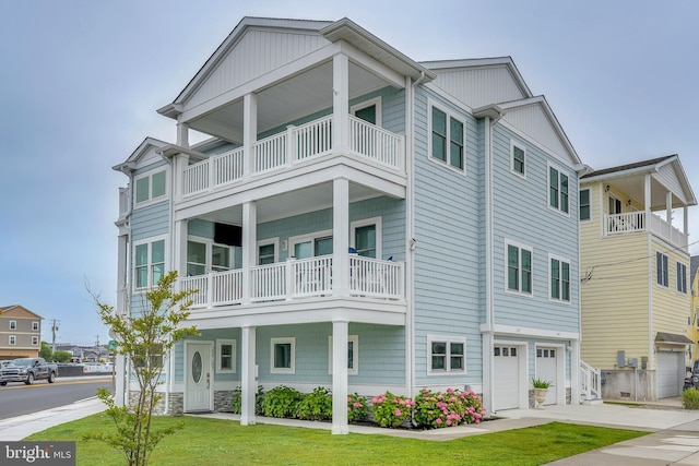 209 N New York Ave Unit 2, North Wildwood, NJ 08260 - multi unit property featuring a balcony, an attached garage, driveway, and a front lawn