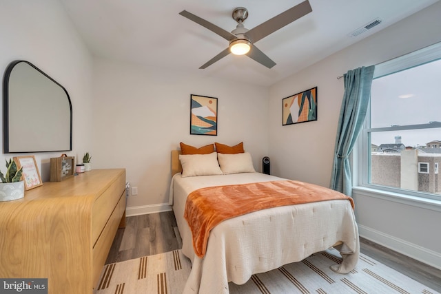 209 N New York Ave Unit 2, North Wildwood, NJ 08260 - bedroom featuring wood finished floors, multiple windows, and a ceiling fan