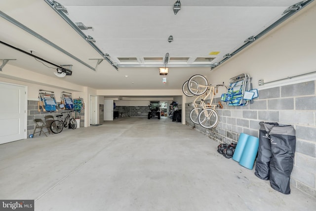 209 N New York Ave Unit 2, North Wildwood, NJ 08260 - garage with a garage door opener and concrete block wall