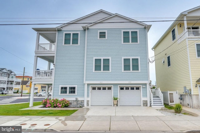 209 N New York Ave Unit 2, North Wildwood, NJ 08260 - view of front facade featuring driveway, an attached garage, and stone siding