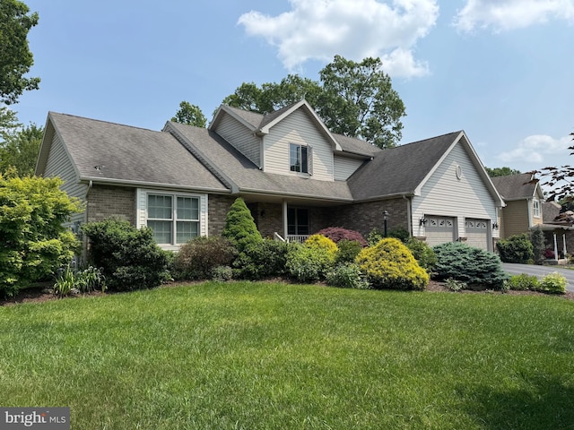 1105 S Providence Rd, Hazle Township, PA 18202 - traditional home featuring brick siding, a front yard, a garage, and roof with shingles