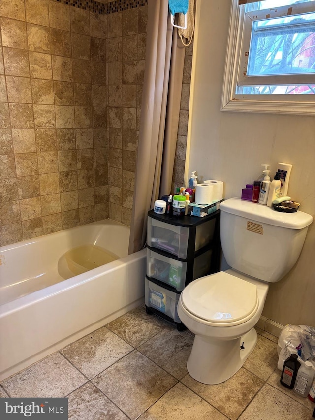 2739 W Harper St W, Philadelphia, PA 19130 - bathroom featuring shower / bath combination with curtain and tile patterned flooring