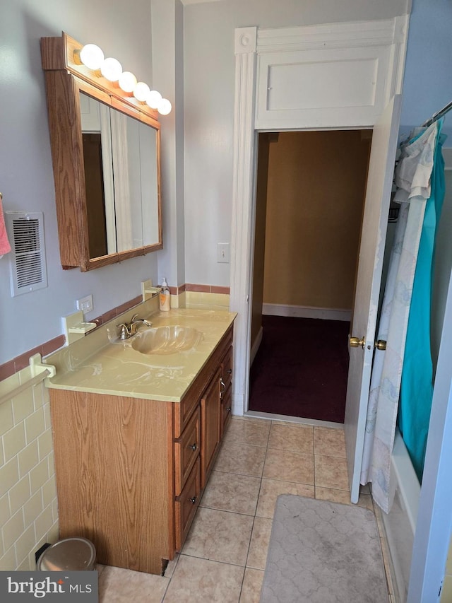 732 NW Morton St NW, Washington, DC 20010 - full bath featuring vanity, tile patterned flooring, and shower / bath combo with shower curtain