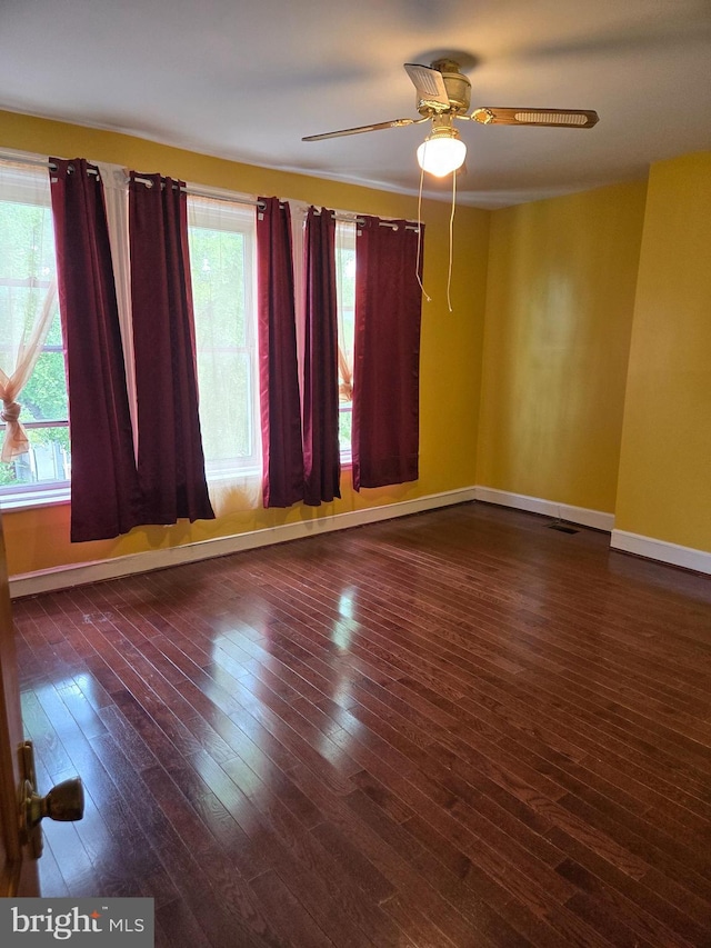 732 NW Morton St NW, Washington, DC 20010 - empty room featuring healthy amount of natural light, hardwood / wood-style flooring, and ceiling fan